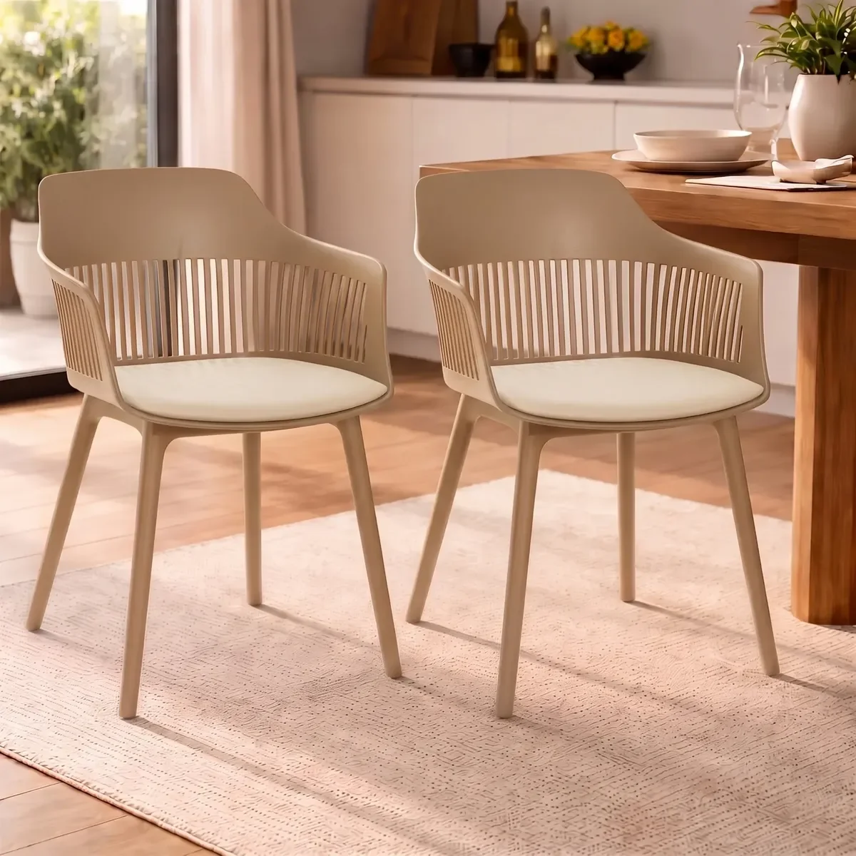 Two beige dining chairs with slatted backs at a wooden table in a bright dining room